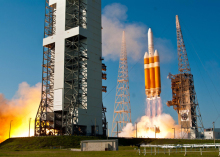 U.S. spy satellite heads into orbit after spectacular launch