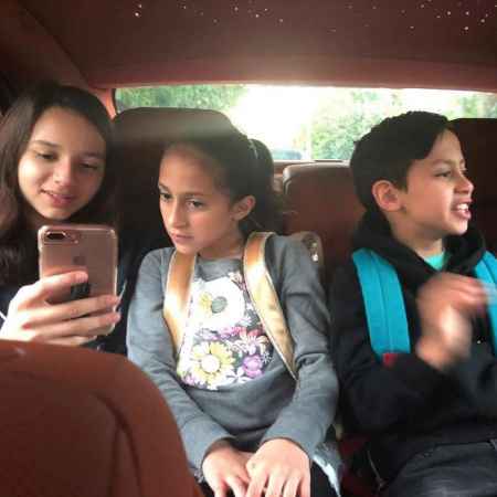 "Morning school run... #happykidshappyfamily" Jennifer Lopez captioned this photo of her kids and beau A Rod's kids in the back of the car on a school run on March 16, 2018.