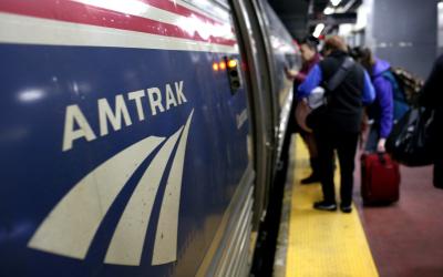 NPeople board an Amtrak train at Penn Station