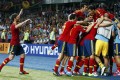 Spain's team players celebrate their third goal against during their Euro 2012 final soccer match at the Olympic stadium in Kiev