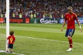Spain's Torres celebrates victory against Italy with his son Leo after their Euro 2012 final soccer match at the Olympic stadium in Kiev