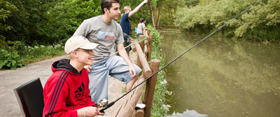 Two people fishing in a river