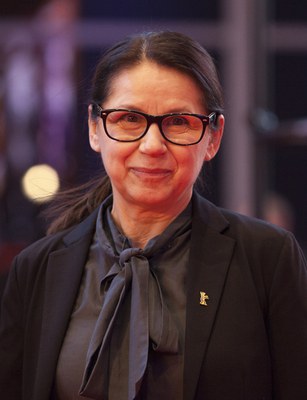 Ildikó Enyedi, b. 1955, is a Hungarian director and screenwriter. In 2017, Enyedi won the Golden Bear at the 67th Berlin International Film Festival for her film On Body and Soul. In 2017, she was accepted into the Academy of Motion Picture Arts and Sciences that awards the annual Oscars.